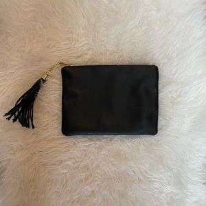 Faux leather zip clutch with tassel
